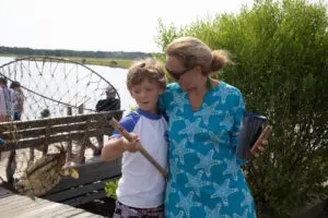 A woman and boy standing next to each other.