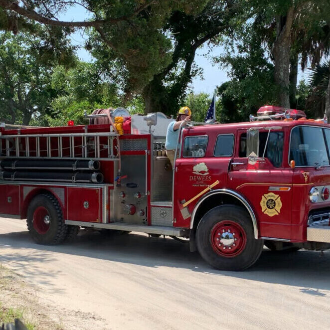 A Dewees Island Public Safety officer rides the fire truck