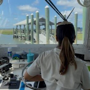 Dewees Ferry Captain docking the Ferry to Dewees Island